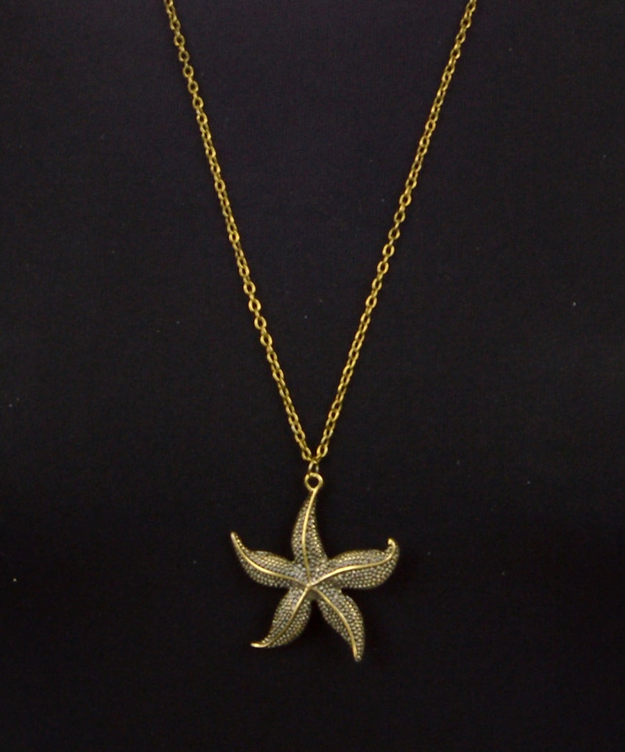 Filigrán réz nyaklánc tengeri csillag alakú medállal.